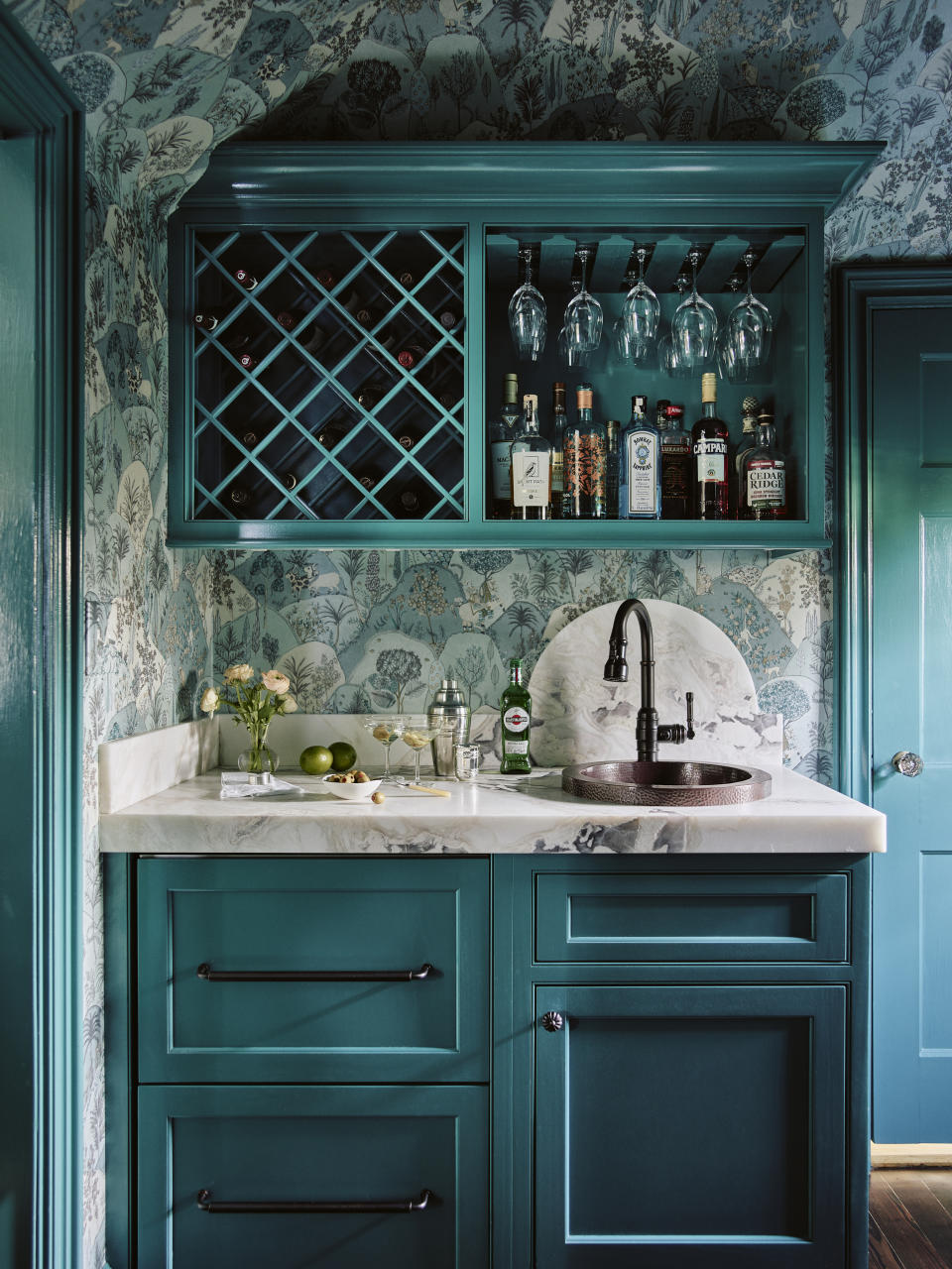 A teal-toned wet bar