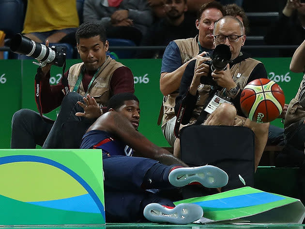 Paul George, after diving for an errant ball against Australia. (Getty Images)