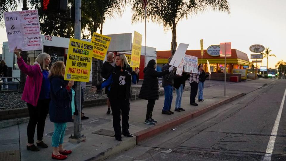 Grover Beach residents protest a proposed 91.8% water rate increase over the next five years, before the Grover Beach City Council meeting on Nov. 13, 2023.