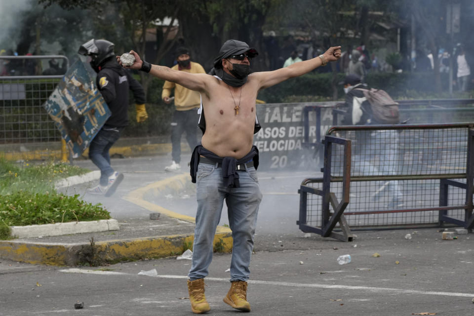 Demonstrators clash with police during protests against the government of President Guillermo Lasso and rising fuel prices in Quito, Ecuador, Tuesday, June 21, 2022. Ecuador's defense minister warned Tuesday that the country's democracy was at risk as demonstrations turned increasingly violent in the capital. (AP Photo/Dolores Ochoa)