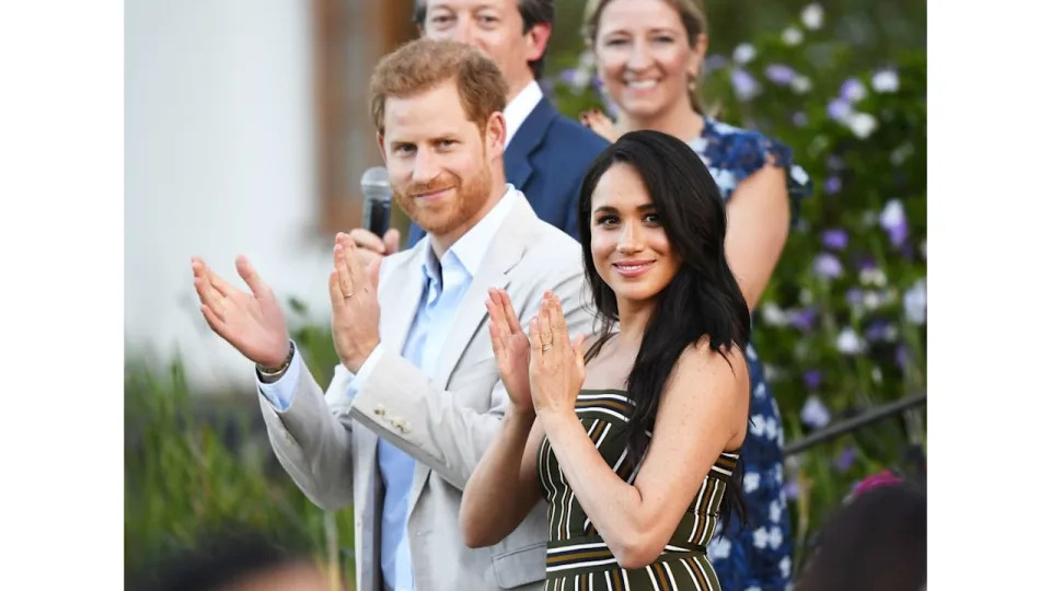 Prince Harry and Meghan Markle clapping