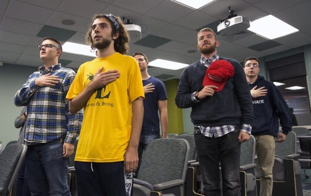 Attendees say the pledge of allegiance at a Bull-Moose Party meeting in 2016.<br> Antonella Crescimbeni / The Daily Collegian