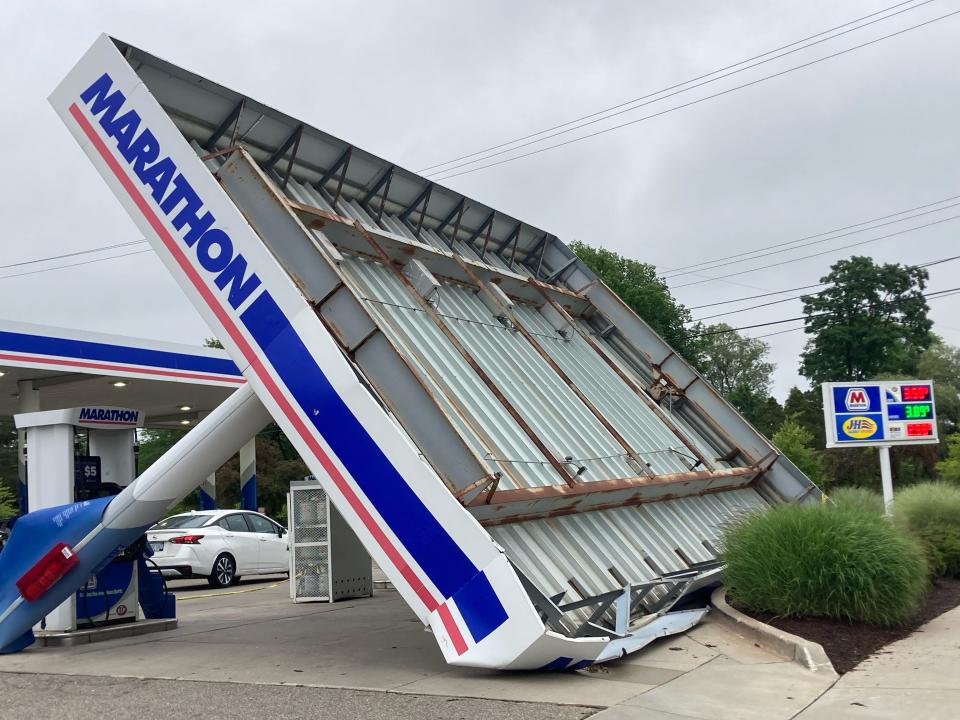A canopy that previously covered fuel pumps at the Marathon gas station on the corner of Harrison and Trowbridge roads in East Lansing on Thursday, July 13, 2023. The canopy was toppled in an overnight storm.