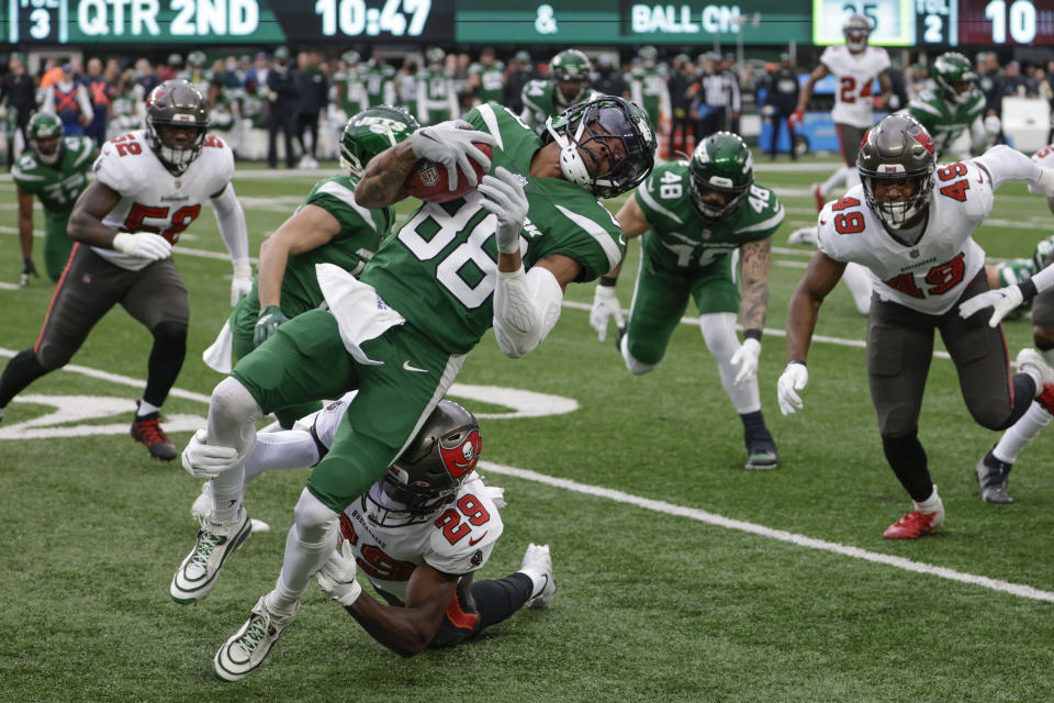 Tampa Bay Buccaneers' Pierre Desir, bottom, tackles New York Jets' Keelan Cole (88) during the first half of an NFL football game, Sunday, Jan. 2, 2022, in East Rutherford, N.J. (AP Photo/Corey Sipkin)