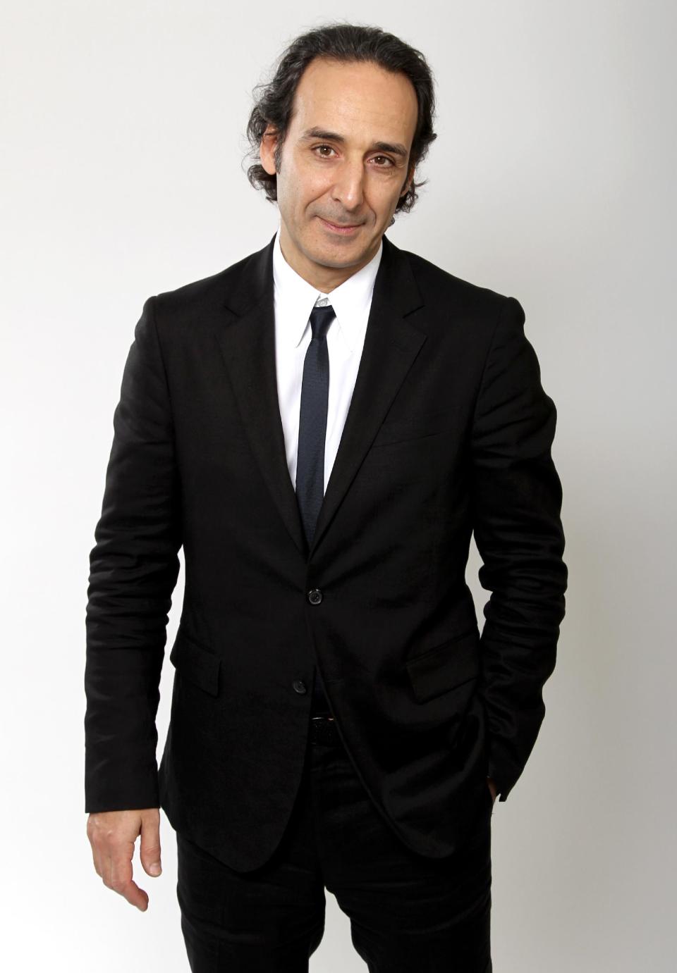 FILE - In this Feb. 4, 2013 file photo, Oscar nominee Alexandre Desplat poses for a portrait at the 2013 Oscar Nominee Luncheon, in Los Angeles. The Academy of Motion Picture Arts and Sciences will present a live Oscar Concert celebrating the year’s nominated scores and songs on Thursday, Feb. 27, 2014, at UCLA's Royce Hall in Los Angeles. The program features an orchestra performing suites from each of the nominated original scores, conducted by their composers, including Desplat for "Philomena." (Photo by Matt Sayles/Invision/AP, file)