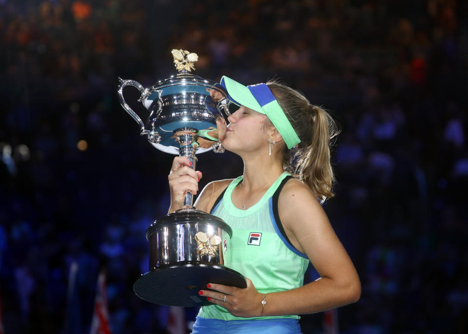 Tennis - Australian Open - Women's Singles Final - Melbourne Park, Melbourne, Australia - February 1, 2020 Sofia Kenin of the U.S. celebrates as she kisses the trophy after winning her match against Spain's Garbine Muguruza REUTERS/Hannah Mckay