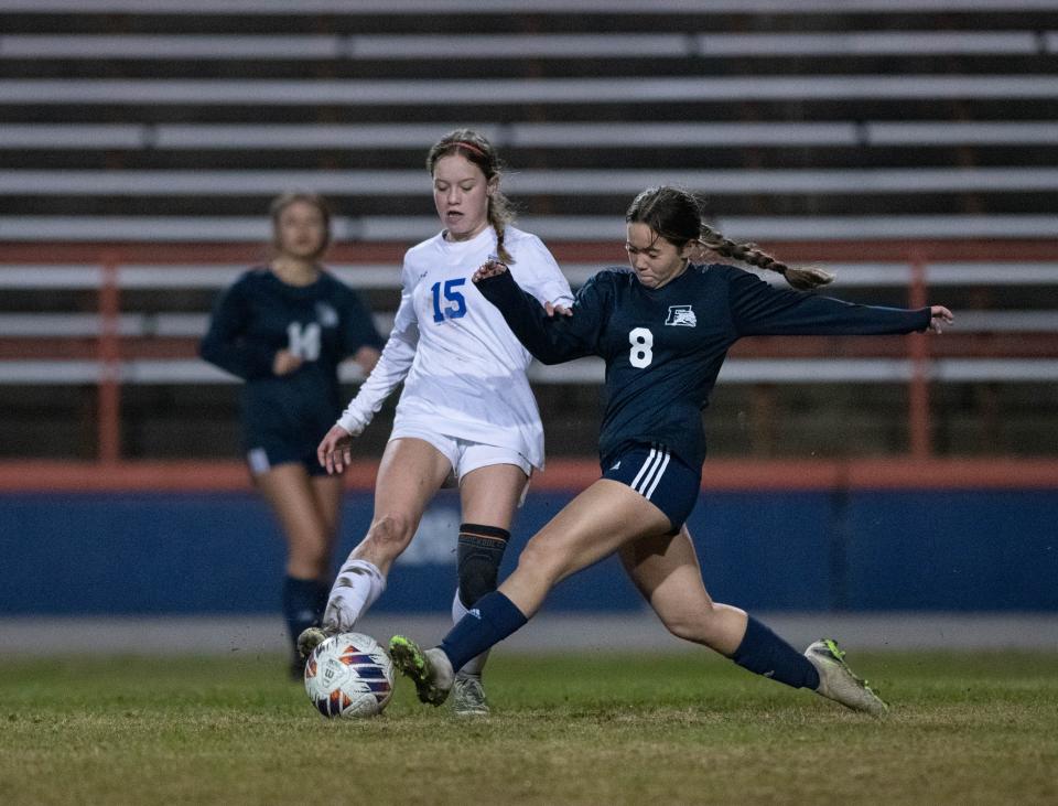 Ruth Oaks (15) and Sabrina Corleone (8) fight for the ball during the Booker T. Washington vs Escambia girls soccer game at Escambia High School in Pensacola on Friday, Jan. 6, 2023.
