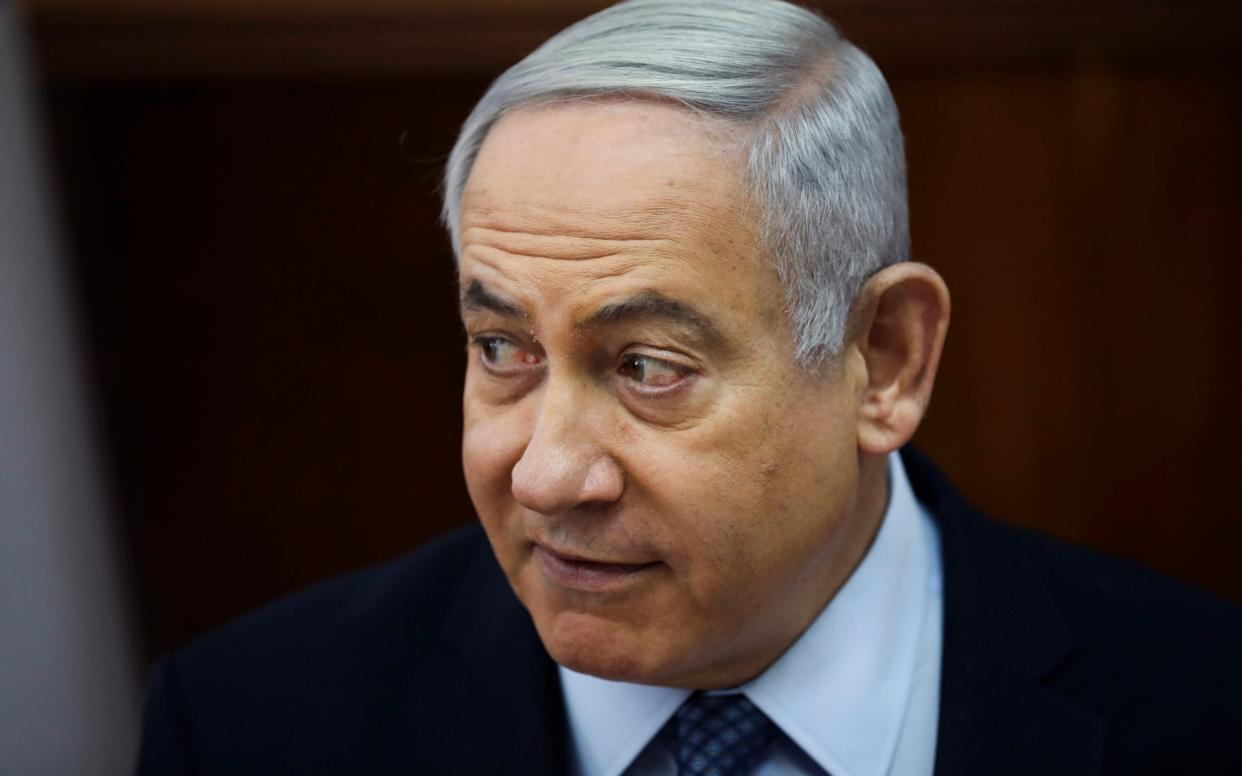 Mr Netanyahu is accused of accepting hundreds of thousands of dollars of champagne and cigars from billionaire friends - AP