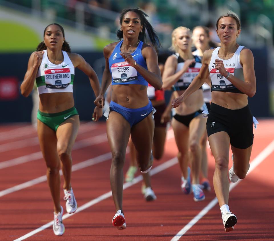 Former Oregon runners Sabrina Southerland, left, and Raevyn Rogers, center, advance out of their heat in the women's 800 meters just behind Sage Hurta, right, on day one of the USA Track and Field Championships 2022 at Hayward Field in Eugene Thursday June 23, 2022.