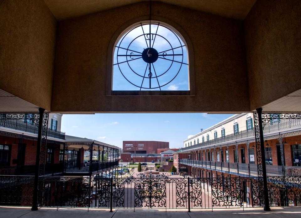 A giant clock embedded in the concrete overlooks the courtyard of Heritage Square in Peoria Heights.