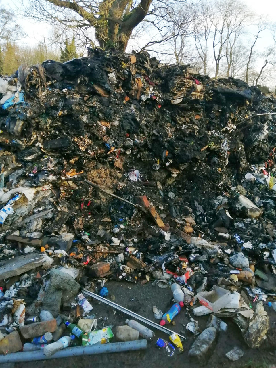 Four tonnes of waste, which stands 15ft high, was left in Watery Gate Lane, near Earl Shilton (Picture: SWNS)