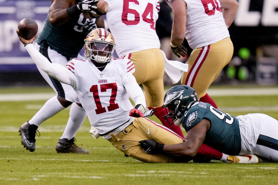 San Francisco 49ers quarterback Josh Johnson (17) passes while being tackled by Philadelphia Eagles defensive tackle Javon Hargrave during the first half of the NFC Championship NFL football game between the Philadelphia Eagles and the San Francisco 49ers on Sunday, Jan. 29, 2023, in Philadelphia. (AP Photo/Seth Wenig)