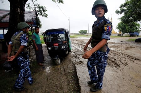 Myanmar police officer stands guard in Maungdaw, Rakhine