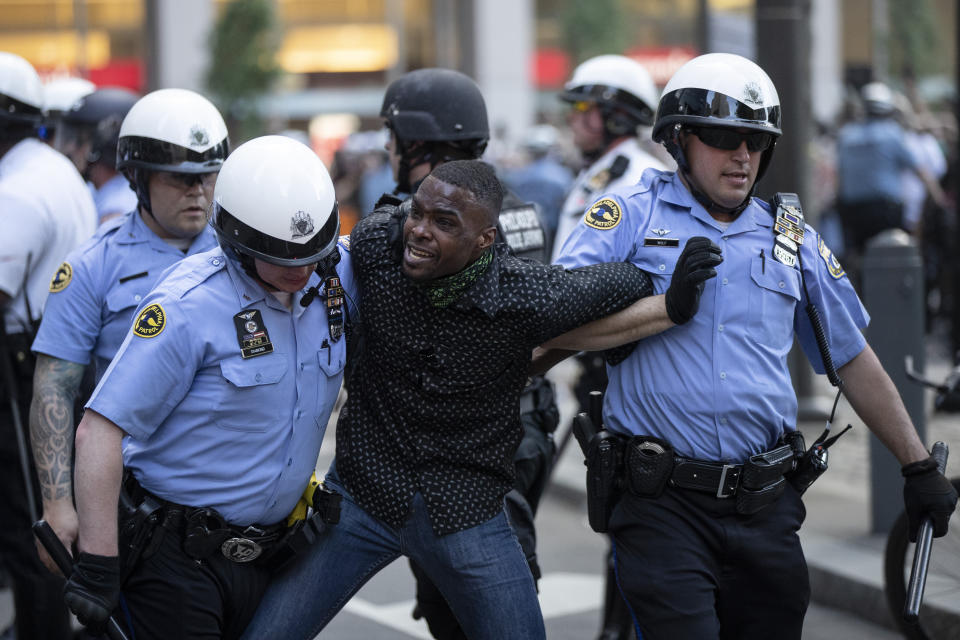 Philadelphia police restrain a man during the Justice for George Floyd Philadelphia Protest on Saturday, May 30, 2020. Protests were held throughout the country over the death of Floyd, a black man who died after being restrained by Minneapolis police officers on May 25. (AP Photo/Matt Rourke)