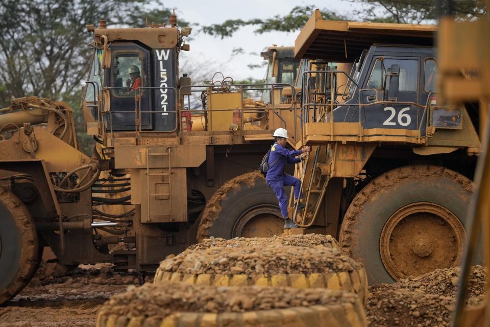 An operator climbs onto a dump truck at the beginning of a shift at PT Vale Indonesia's nickel processing plant in Sorowako, South Sulawesi, Indonesia, Tuesday, Sept. 12, 2023. Demand for critical minerals like nickel and cobalt is surging as climate change hastens a transition to renewable energy, boosting carbon emissions by miners and processors of such materials. (AP Photo/Dita Alangkara)