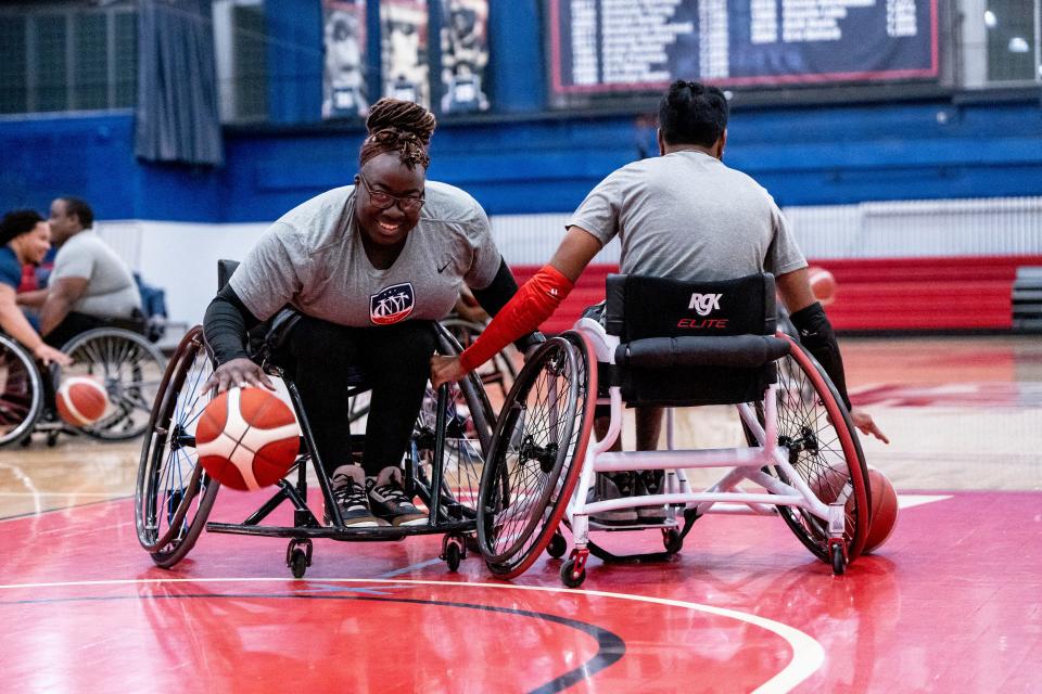 The CUNY wheelchair basketball team practices at Queens College on Thursday October 20, 2022. (From left) Destini Mitchell-Murray and Malkeet Singh-Gill practice drills. 