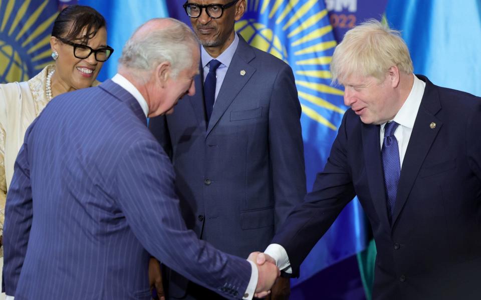 Boris Johnson shakes hands with the Prince of Wales in Kigali, Rwanda, this morning - Chris Jackson/PA