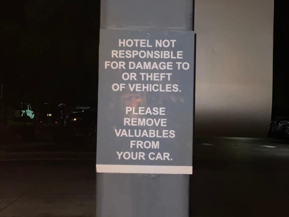 warning sign in hotel parking lot