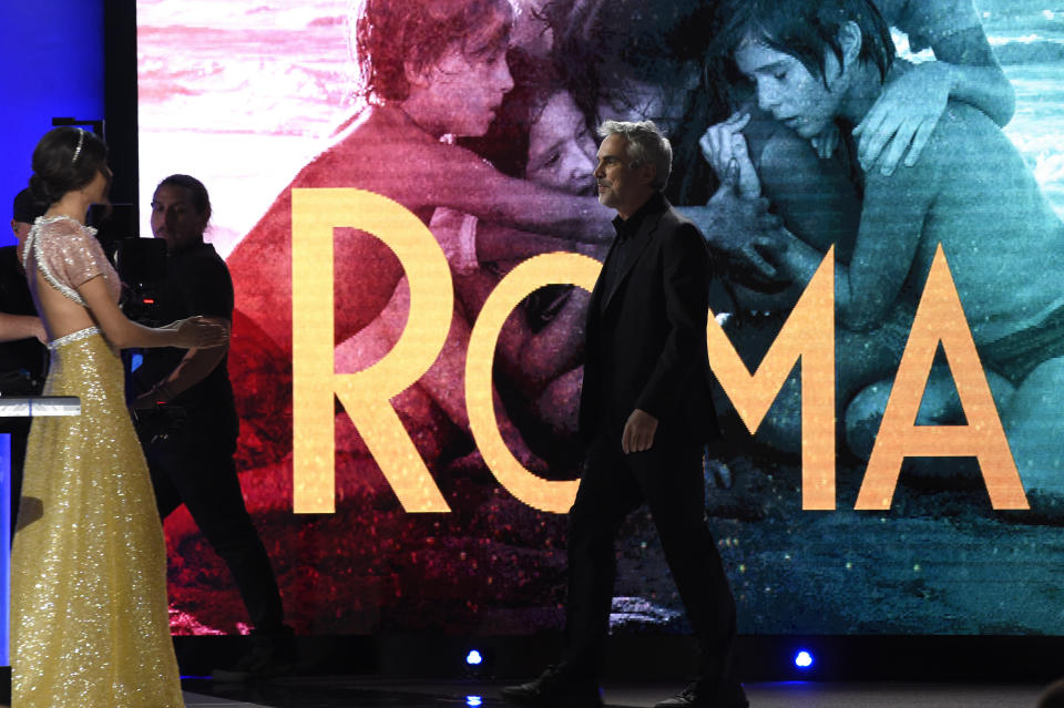 Alfonso Cuaron walks onstage to accept the award for best international film for "Roma" at the 34th Film Independent Spirit Awards on Saturday, Feb. 23, 2019, in Santa Monica, Calif. (Photo by Chris Pizzello/Invision/AP)