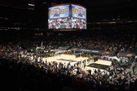 Fans and players pause for a moment of silence to honor George Floyd prior to Game 2 of an NBA basketball first-round playoff series between the Phoenix Suns and the Los Angeles Lakers Tuesday, May 25, 2021, in Phoenix. (AP Photo/Ross D. Franklin)