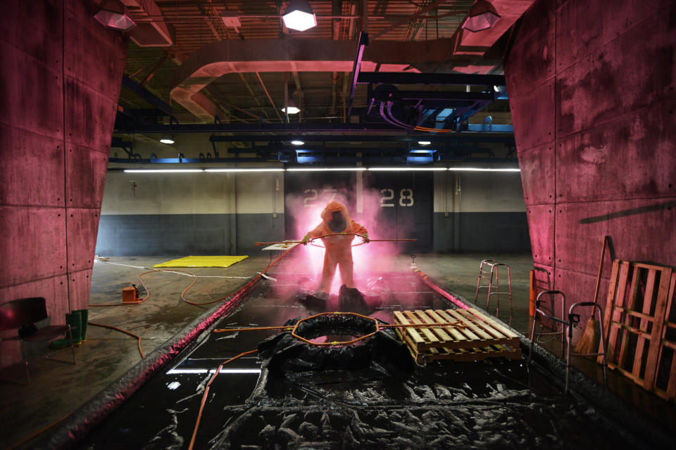 Tech. Sgt. Timothy Cotterall is decontaminated following attempts to identify multiple biological contaminants in a simulated lab March 18, 2015, during a Global Dragon training event at Guardian Centers of Georgia. 