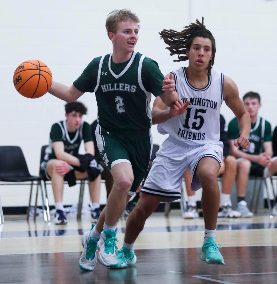 Tower Hill's Charles Habgood (2) looks to pass along the baseline as Friends' Avery Gaines pursues in the second half of the Hillers' 70-47 win at Wilmington Friends, Friday, Jan. 20, 2023.