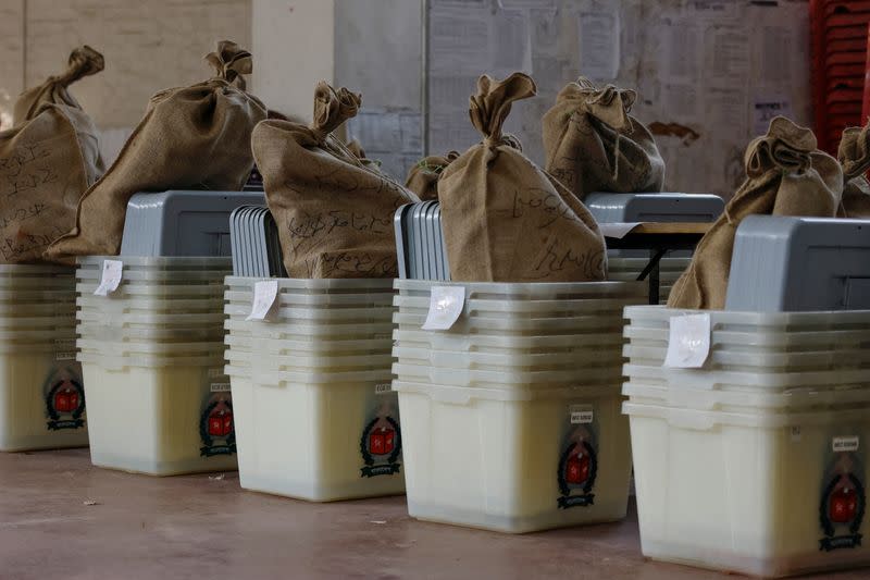 Ballot boxes are stored at the Wills Little Flower School before being distributed to the voting centres as part of election preparation, a day ahead of the general election in Dhaka