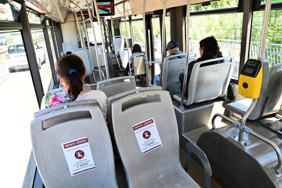 Passengers are forbidden from sitting on some seats on this bus in Rome, Italy, on Monday.