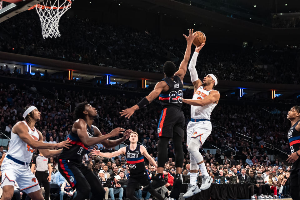 New York Knicks guard Josh Hart, right, shoots over Detroit Pistons' Jaden Ivey (23) during the first half of an NBA basketball game in New York, Monday, March 25, 2024. (AP Photo/Peter K. Afriyie)