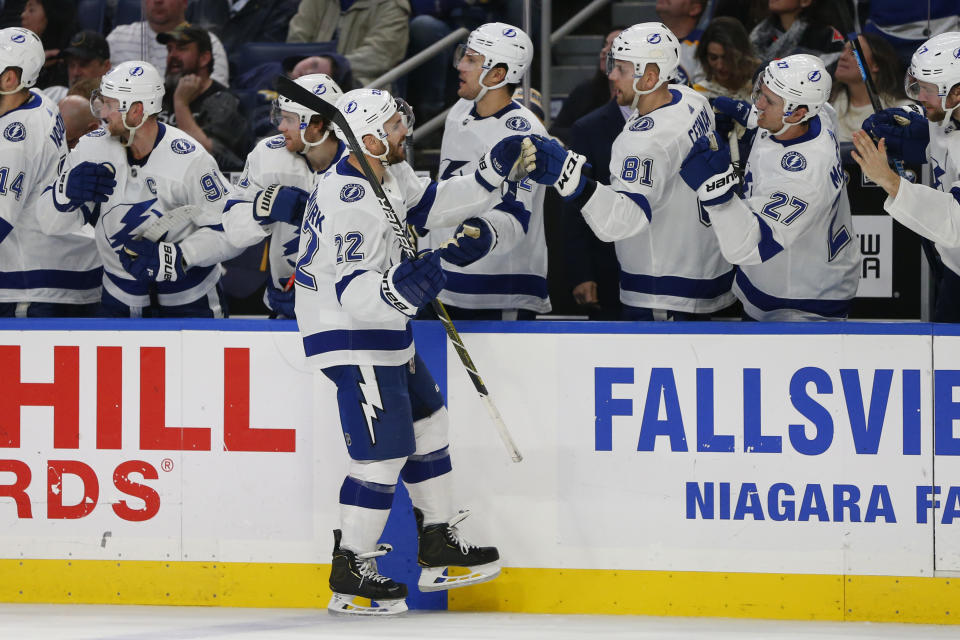 Tampa Bay Lightning defenseman Kevin Shattenkirk (22) is congratulated for his goal during the third period of the team's NHL hockey game against the Buffalo Sabres, Tuesday, Dec. 31, 2019, in Buffalo, N.Y. (AP Photo/Jeffrey T. Barnes)