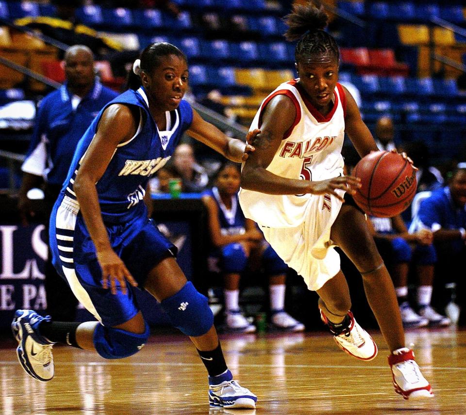 Seventy First's Ta'wuana Cook takes the ball down court past Westover's Brittani Owens during the fourth quarter of the Holiday Classic championship game at the Crown Coliseum, Dec. 30, 2005.
