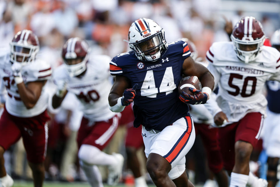 Auburn running back Sean Jackson (44) carries the ball for a touchdown against Massachusetts during the second half of an NCAA college football game Saturday, Sept. 2, 2023, in Auburn, Ala. (AP Photo/Butch Dill)