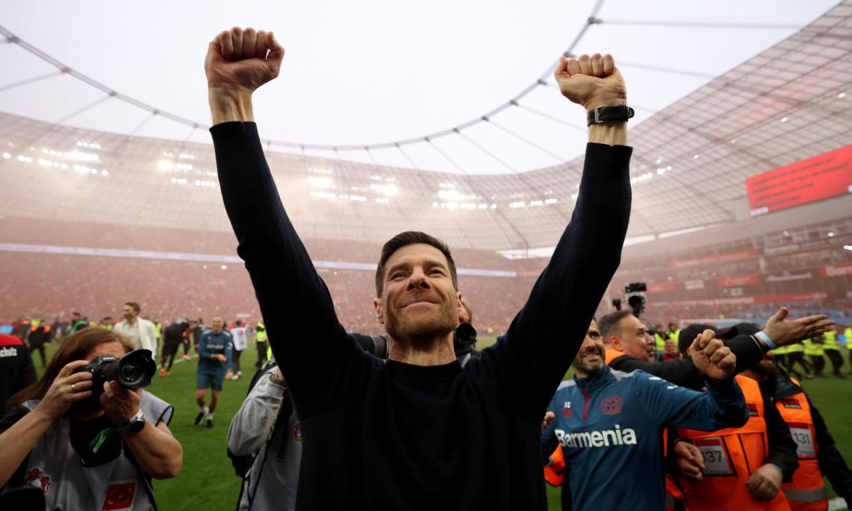 <span>Xabi Alonso celebrates after Bayer Leverkusen won the Bundesliga title with a 5-0 home win against Werder Bremen. </span><span>Photograph: Lars Baron/Getty Images</span>