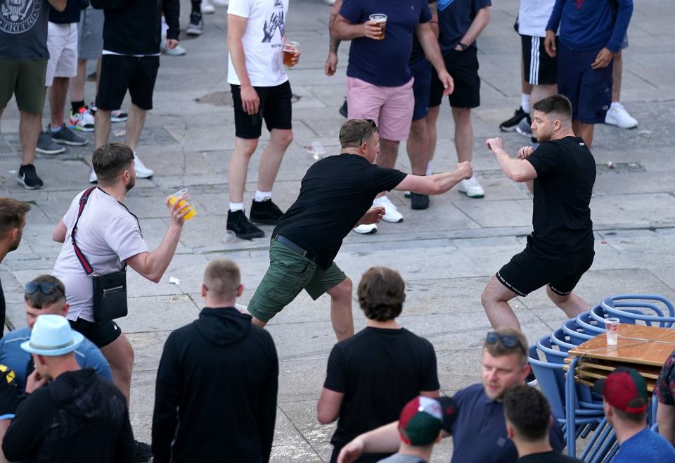 <p>Fans in Porto clash ahead of the Champions League final</p> (PA)