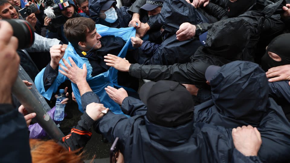 Georgian law enforcement officers detain a demonstrator near the parliament in Tbilisi on May 14. - Giorgi Arjevanidze/AFP/Getty Images