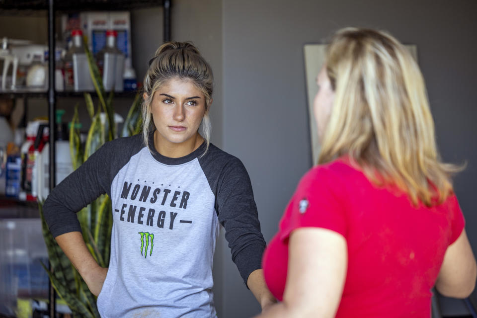 In this photo provided by Can Am Off-Road, Hailie Deegan is interviewed in her home in Denver, N.C., Aug. 30. 2022. Deegan is the only full-time female driver at the NASCAR national level but her future is unclear after Friday night’s Truck Series season finale. (Can Am Off-Road via AP)