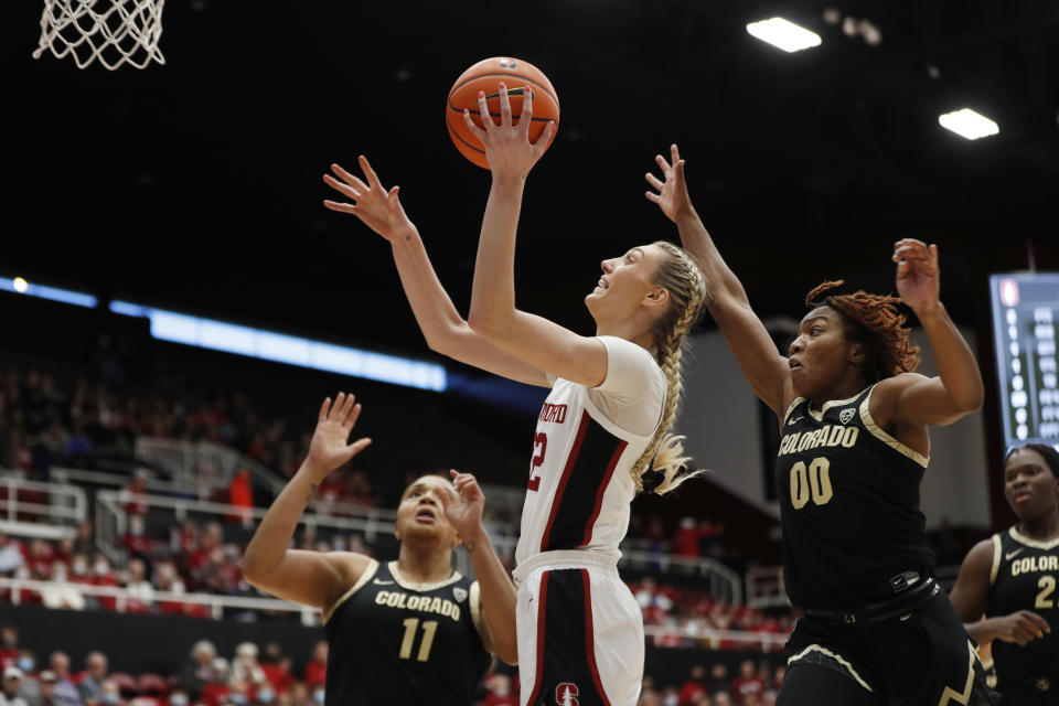 Stanford forward Cameron Brink, center, shoots against Colorado guard Jaylyn Sherrod (00) during the first quarter of an NCAA college basketball game in Stanford, Calif., Sunday, Jan. 22, 2023. (AP Photo/Jim Gensheimer)