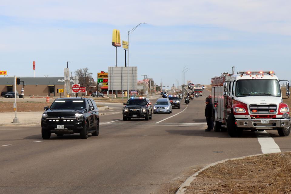 The body of Fritch Volunteer Fire Department Chief Zeb Smith is escorted through Amarillo Tuesday, as the convoy makes its way from Borger to Lubbock. Smith suffered a medical emergency and died while fighting a fire Tuesday, officials confirmed.
