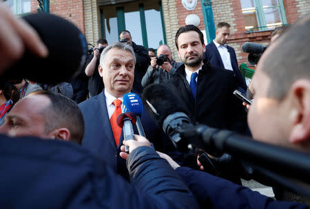 Current Hungarian Prime Minister Viktor Orban gives a statement to the media after leaving a polling station during Hungarian parliamentary election in Budapest, Hungary, April 8, 2018. REUTERS/Bernadett Szabo