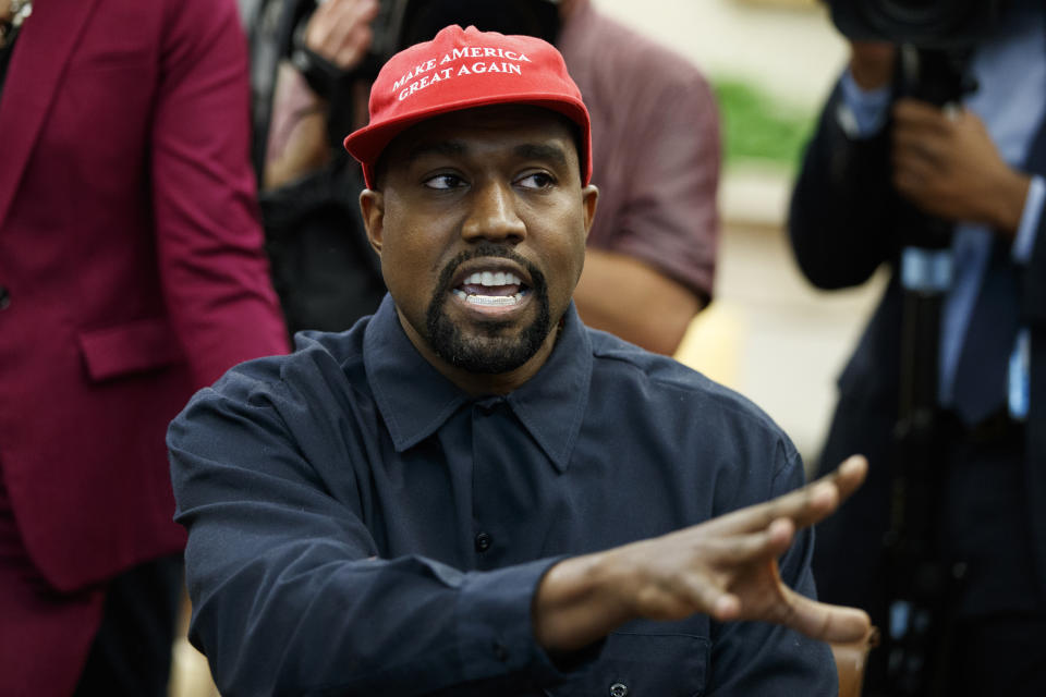 FILE - In this Oct. 11, 2018, file photo, Rapper Kanye West speaks during a meeting in the Oval Office of the White House with President Donald Trump, in Washington. Cardi B, Pharrell, Kanye West were among the celebrities who fanned out across Miami for a week of glamorous parties toasting the world’s best artists during Art Basel. The prestigious extension of the annual contemporary art fair in Basel, Switzerland, officially opened Thursday, Dec. 6.(AP Photo/Evan Vucci, File)