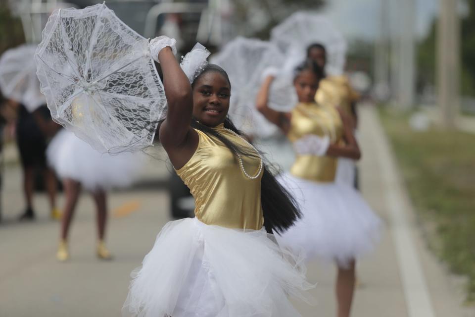 Participants in the Dunbar Easter Parade make their way down Ford Street on Sunday, April 9, 2023, in Fort Myers.