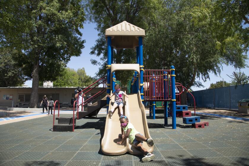 WEST HILLS, CA - MAY 03: The Los Angeles Unified School District has reopened playgrounds on its school campuses allowing students to play together again like these youngsters at Hamlin Charter Academy in West Hills on Monday, May 3, 2021. (Myung J. Chun / Los Angeles Times)