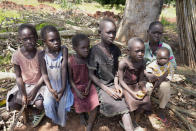 Children listen as they are educated about about the risks of unexploded mines, in Moli village, Eastern Equatoria state, in South Sudan Friday, May 12, 2023. As South Sudanese trickle back into the country after a peace deal was signed in 2018 to end a five-year civil war, many are returning to areas riddled with mines left from decades of conflict. (AP Photo/Sam Mednick)