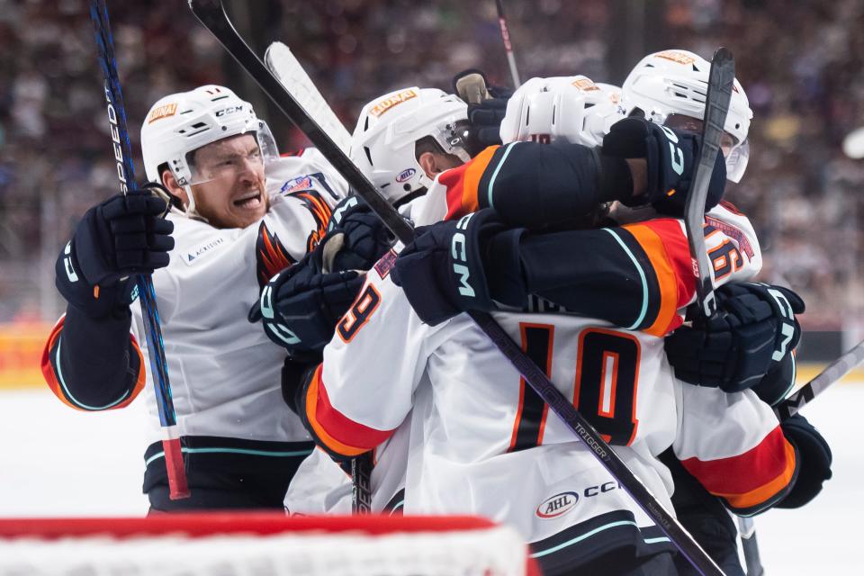 Coachella Valley players celebrate a goal from Cameron Hughes (19) during the third period of Game 3 of the Calder Cup Finals against Hershey at the Giant Center in Hershey, Pa., Tuesday, June 13, 2023.