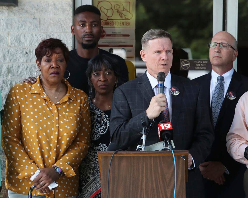 “Every time I come up here and our team gathers, Pam goes through a living nightmare,” attorney Bobby DiCello (at microphone) said Tuesday of Jayland Walker’s mother, Pamela Walker (left). The family members and lawyers are shown at a July press conference, a gathering that was repeated this week. (Karen Schiely/Akron Beacon Journal via AP)