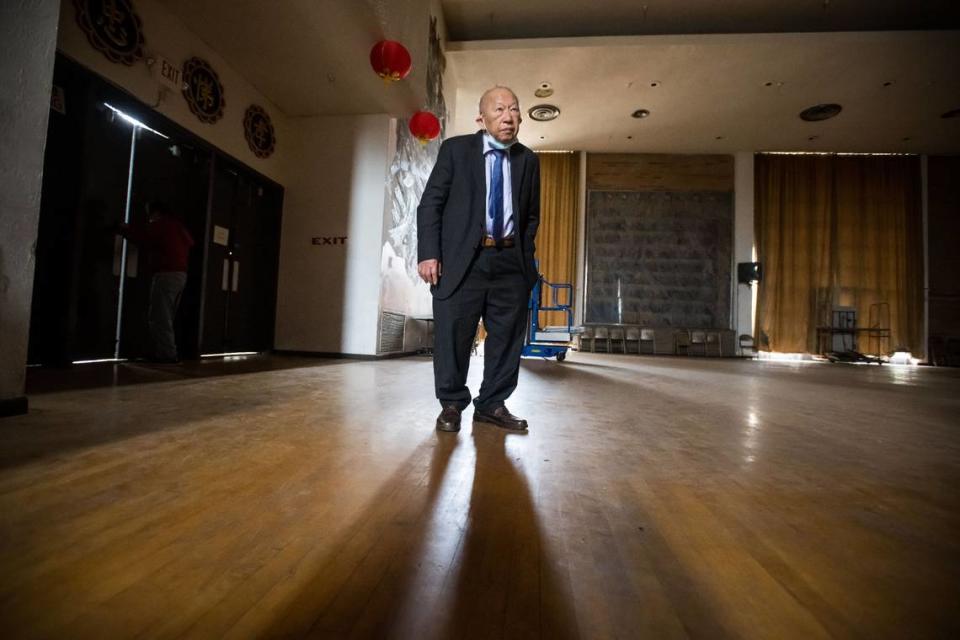 Jong Chen, president of the Sacramento Chinese Consolidated Benevolent Association, walks through the Confucius Temple’s auditorium during a tour Friday, March 3, 2023, in Sacramento’s Chinatown Mall.