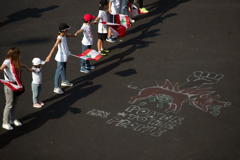 Demonstrators form a human chain during ongoing anti-government protests