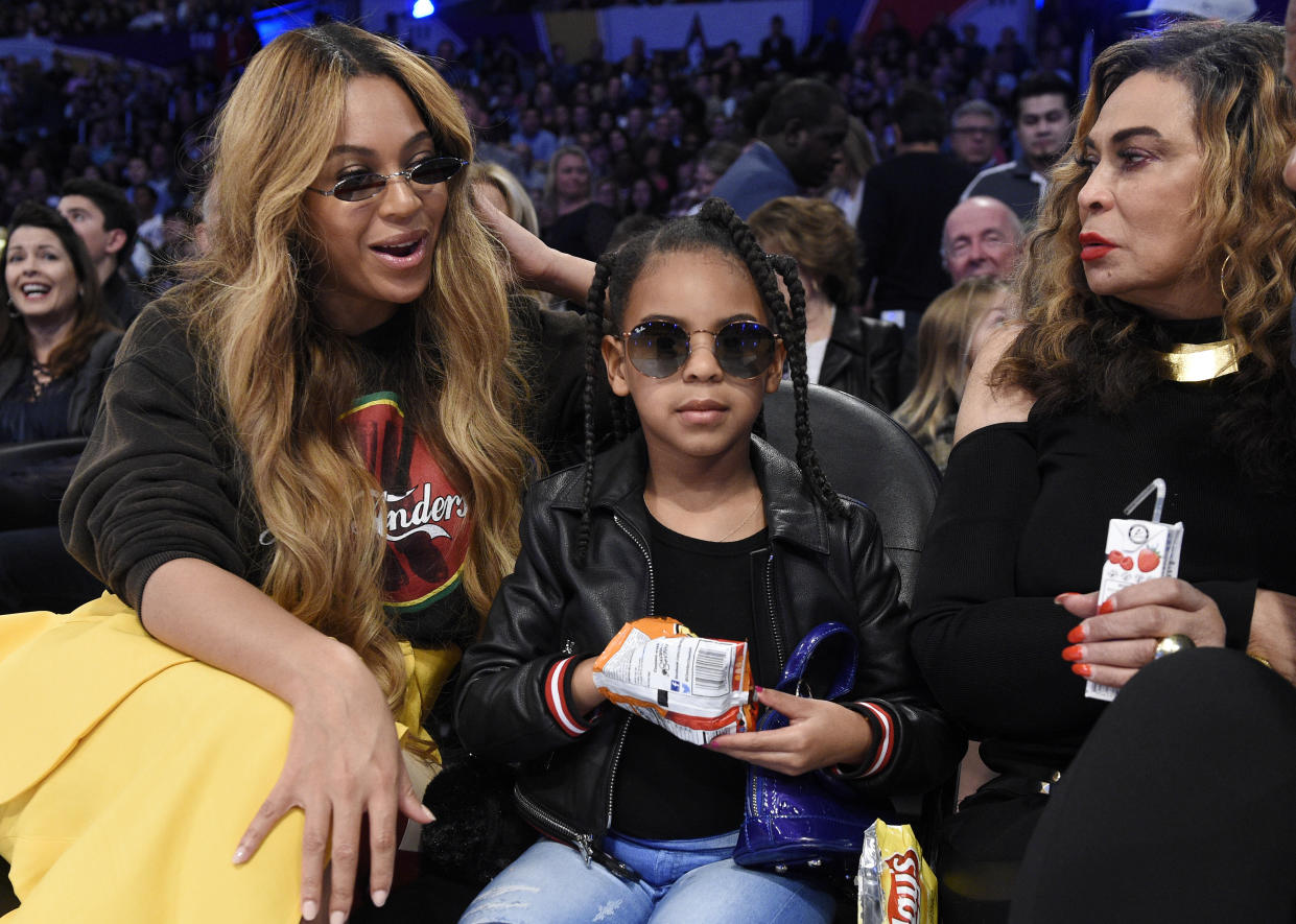 Beyoncé with her daughter Blue Ivy Carter and her mother, Tina Knowles Lawson, at the NBA All-Star Game in Los Angeles on Feb. 18, 2018. (AP Photo/Chris Pizzello)