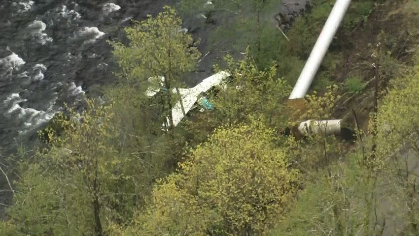 Crews used ropes to rescue the two men from the wreckage.
