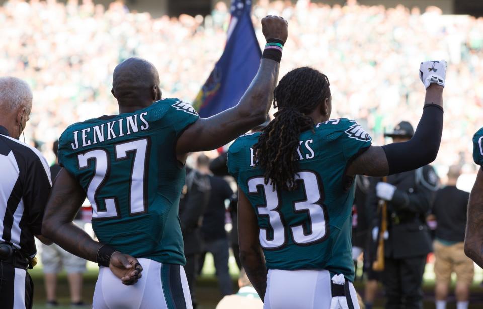 <p>Philadelphia Eagles strong safety Malcolm Jenkins (27) and defensive back Ron Brooks (33) hold up fists during the national anthem before action against the Pittsburgh Steelers at Lincoln Financial Field. Mandatory Credit: Bill Streicher-USA TODAY Sports </p>